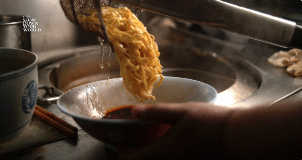Freshly made noodles in super slow motion