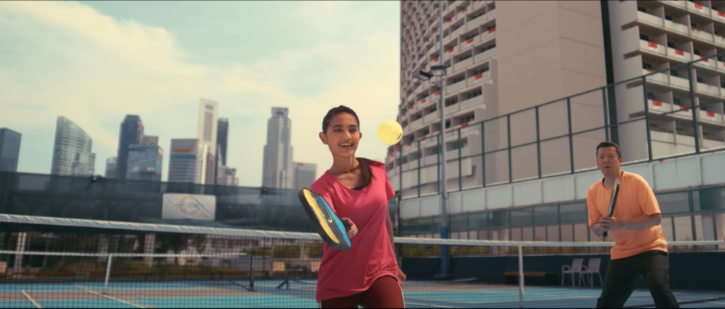 A girl playing pickel ball in super slow motion in Singapore