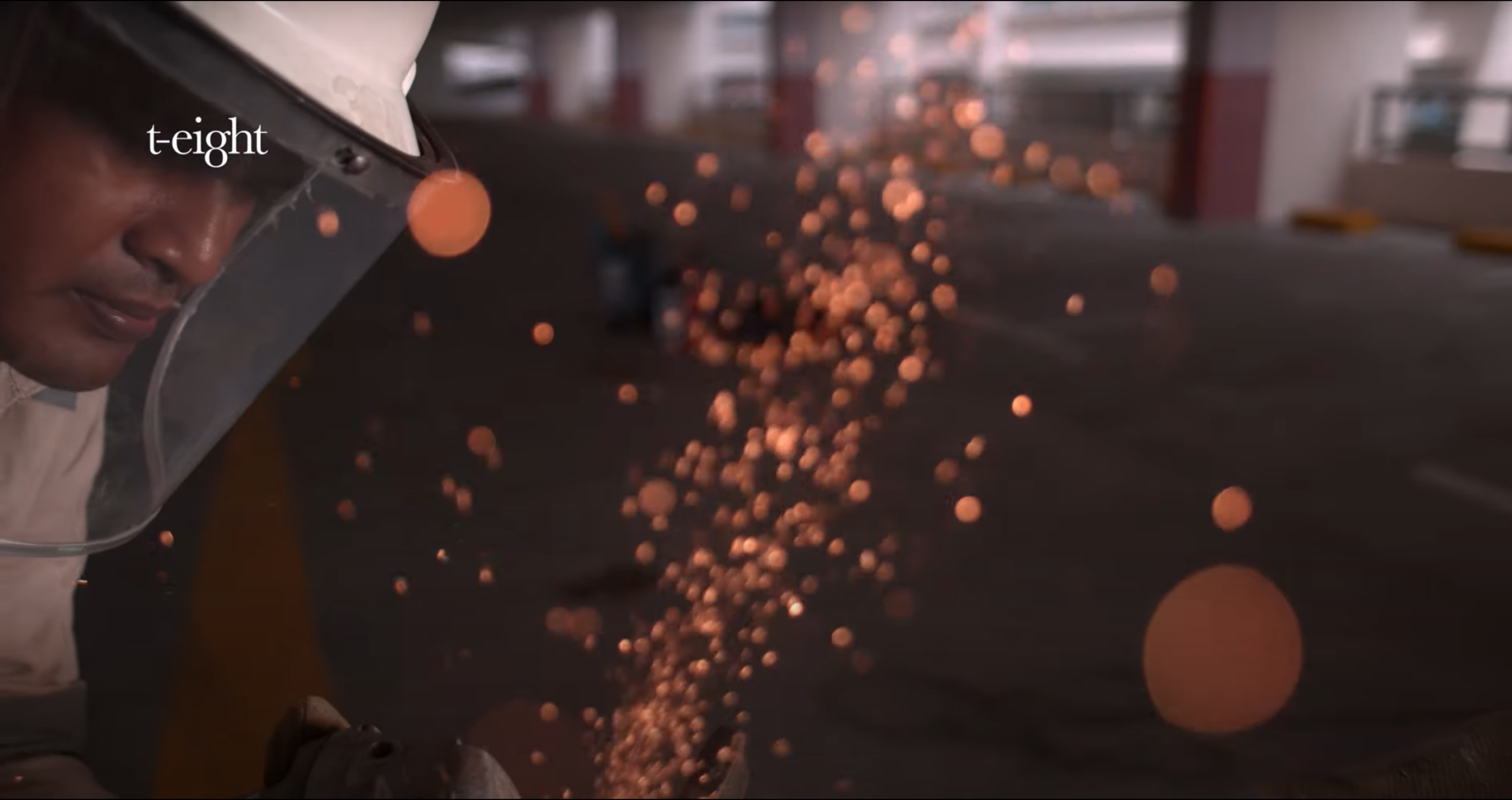 Sparks and airborne particles during an industrial process filmed in high speed
